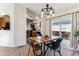 Bright dining area with sliding glass doors to patio at 5768 Alcott St, Denver, CO 80221