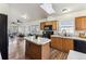 Spacious kitchen with island and stainless steel appliances at 5768 Alcott St, Denver, CO 80221