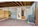 Backyard deck with air conditioning unit and sliding door into the basement space at 1209 S Flower Cir # C, Lakewood, CO 80232