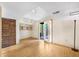 Spacious basement area with hardwood floors, overhead lighting, closet, and door to outdoor space at 1209 S Flower Cir # C, Lakewood, CO 80232