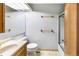 Clean bathroom featuring a vanity, toilet, and shower-tub combo at 1209 S Flower Cir # C, Lakewood, CO 80232