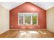 Bright vaulted bedroom featuring a bay window and hardwood floors at 1209 S Flower Cir # C, Lakewood, CO 80232