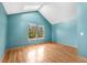 Vaulted bedroom features a skylight, a bay window, and hardwood floors at 1209 S Flower Cir # C, Lakewood, CO 80232