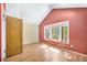 Vaulted bedroom features a bay window, hardwood floors, and a closet at 1209 S Flower Cir # C, Lakewood, CO 80232