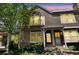 Inviting townhouse showcasing brick accents, bay window, and well-maintained front yard at 1209 S Flower Cir # C, Lakewood, CO 80232