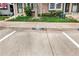 Well-maintained townhome with brick accents, neatly landscaped front yard and assigned parking in front at 1209 S Flower Cir # C, Lakewood, CO 80232