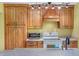 Kitchen boasts wooden cabinets, granite countertops, and stainless steel appliances at 1209 S Flower Cir # C, Lakewood, CO 80232
