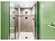 Walk-in shower with white marble tile and decorative tile design with white shower base at 1209 S Flower Cir # C, Lakewood, CO 80232