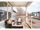 Inviting balcony with outdoor furniture and neighborhood views at 2773 Roslyn St, Denver, CO 80238