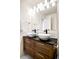 Bathroom with double sink vanity, modern fixtures, and neutral finishes at 2773 Roslyn St, Denver, CO 80238