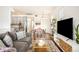 Bright living room featuring modern furniture, a stylish rug, and ample space for relaxation and entertainment at 2773 Roslyn St, Denver, CO 80238