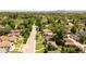 Aerial view of the neighborhood, showcasing tree-lined streets, well-maintained homes, and proximity to Pferdesteller Park at 5044 W Moncrieff Pl, Denver, CO 80212