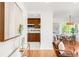 Open-concept dining area connected to the kitchen, featuring hardwood floors at 5044 W Moncrieff Pl, Denver, CO 80212
