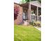 Close up of the front porch of a charming brick home with an ADT security system at 5044 W Moncrieff Pl, Denver, CO 80212