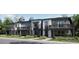 Modern townhome exterior featuring individual balconies and landscaped front yards at 8939 San Antonio St, Littleton, CO 80125