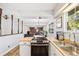 Open kitchen area with modern appliances and a view to the living room at 5054 W 61St Dr, Arvada, CO 80003