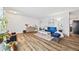 Cozy living area with wood-look flooring, stylish furnishings, and natural light, creating a welcoming atmosphere at 5054 W 61St Dr, Arvada, CO 80003