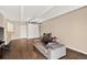 Spacious living room featuring hardwood floors, a comfortable sofa, and a neutral color scheme at 1365 Columbine St # 403, Denver, CO 80206