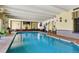 Indoor swimming pool featuring ample lighting and adjacent seating areas at 1365 Columbine St # 403, Denver, CO 80206