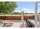 Relaxing backyard featuring a hot tub, seating area, and a privacy fence creating an oasis at 4534 Nepal St, Denver, CO 80249