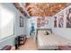 Cozy basement bedroom with exposed ceiling beams and unique string light decorations at 4534 Nepal St, Denver, CO 80249