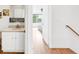 Bathroom featuring double sinks, a walk-in closet, and views of a bright bedroom at 4534 Nepal St, Denver, CO 80249