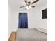 Comfortable bedroom featuring a ceiling fan and a window with a dinosaur-themed curtain at 4534 Nepal St, Denver, CO 80249