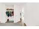 Bedroom with a walk-in closet holding clothes and stuffed animals for storage at 4534 Nepal St, Denver, CO 80249
