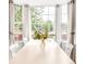 Bright dining area featuring a large bay window offering scenic views and lots of natural light at 4534 Nepal St, Denver, CO 80249