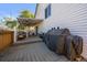Backyard patio featuring dining furniture, outdoor seating area, wooden deck, and grill at 18902 E 17Th Ave, Aurora, CO 80011