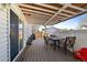 Backyard patio featuring dining furniture, outdoor seating area and wooden deck at 18902 E 17Th Ave, Aurora, CO 80011