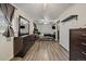 Bedroom with ceiling fan, accent wall, grey floors, dresser and TV at 18902 E 17Th Ave, Aurora, CO 80011