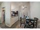 A cozy dining area adjoining an open kitchen with stainless steel appliances and a ceiling fan at 18902 E 17Th Ave, Aurora, CO 80011