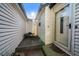 Home exterior featuring a wooden deck and glass paned front door at 18902 E 17Th Ave, Aurora, CO 80011
