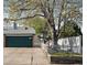 Charming home featuring a two-car garage and a well-maintained front yard, all beneath a large tree at 18902 E 17Th Ave, Aurora, CO 80011