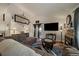 Bright living room with a fireplace, modern furniture, and a sliding glass door at 18902 E 17Th Ave, Aurora, CO 80011