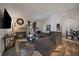 Cozy living room featuring a brick fireplace, plush seating, and hardwood floors at 18902 E 17Th Ave, Aurora, CO 80011