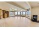 Large empty basement with wood laminate flooring, lots of natural light, and built in shelves at 2981 Rock Cir, Elizabeth, CO 80107