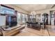 Dining room featuring a fireplace, hardwood floors, and elegant chandelier at 2981 Rock Cir, Elizabeth, CO 80107
