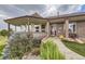 Inviting front entrance with a charming porch and well-maintained landscaping at 2981 Rock Cir, Elizabeth, CO 80107