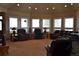 Spacious living room with large windows, comfortable seating, and neutral tones for a relaxing atmosphere at 2981 Rock Cir, Elizabeth, CO 80107