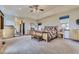 Spacious main bedroom featuring tray ceilings, large windows, and an ensuite bathroom at 2981 Rock Cir, Elizabeth, CO 80107