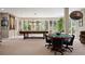 Finished basement with a pool table, game table, and expansive windows for natural light at 315 Prospect Dr, Castle Rock, CO 80108