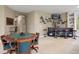Finished basement with custom wet bar, game table, and room for entertaining guests at 315 Prospect Dr, Castle Rock, CO 80108