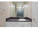 Clean bathroom with granite countertops, single vanity and walk in shower with glass doors at 315 Prospect Dr, Castle Rock, CO 80108
