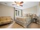 Cozy bedroom with a decorative queen size bed, a sitting bench and a relaxing atmosphere at 315 Prospect Dr, Castle Rock, CO 80108