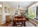 Charming dining room features a large window, chandelier, and traditional furnishings for comfortable gatherings at 315 Prospect Dr, Castle Rock, CO 80108