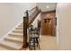 Foyer staircase, custom table, and decorative touches creating a welcoming ambiance at 315 Prospect Dr, Castle Rock, CO 80108
