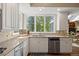 Well-lit kitchen features stainless steel appliances, granite countertops, and a window with views of the backyard at 315 Prospect Dr, Castle Rock, CO 80108