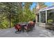 Outdoor patio with a dining table and lush greenery, great for relaxation at 315 Prospect Dr, Castle Rock, CO 80108